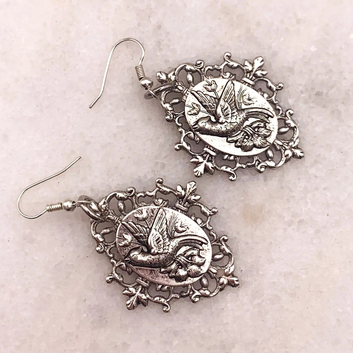 Ghost and Lola Sky Whisperer Earrings showing the ornate antique silver setting