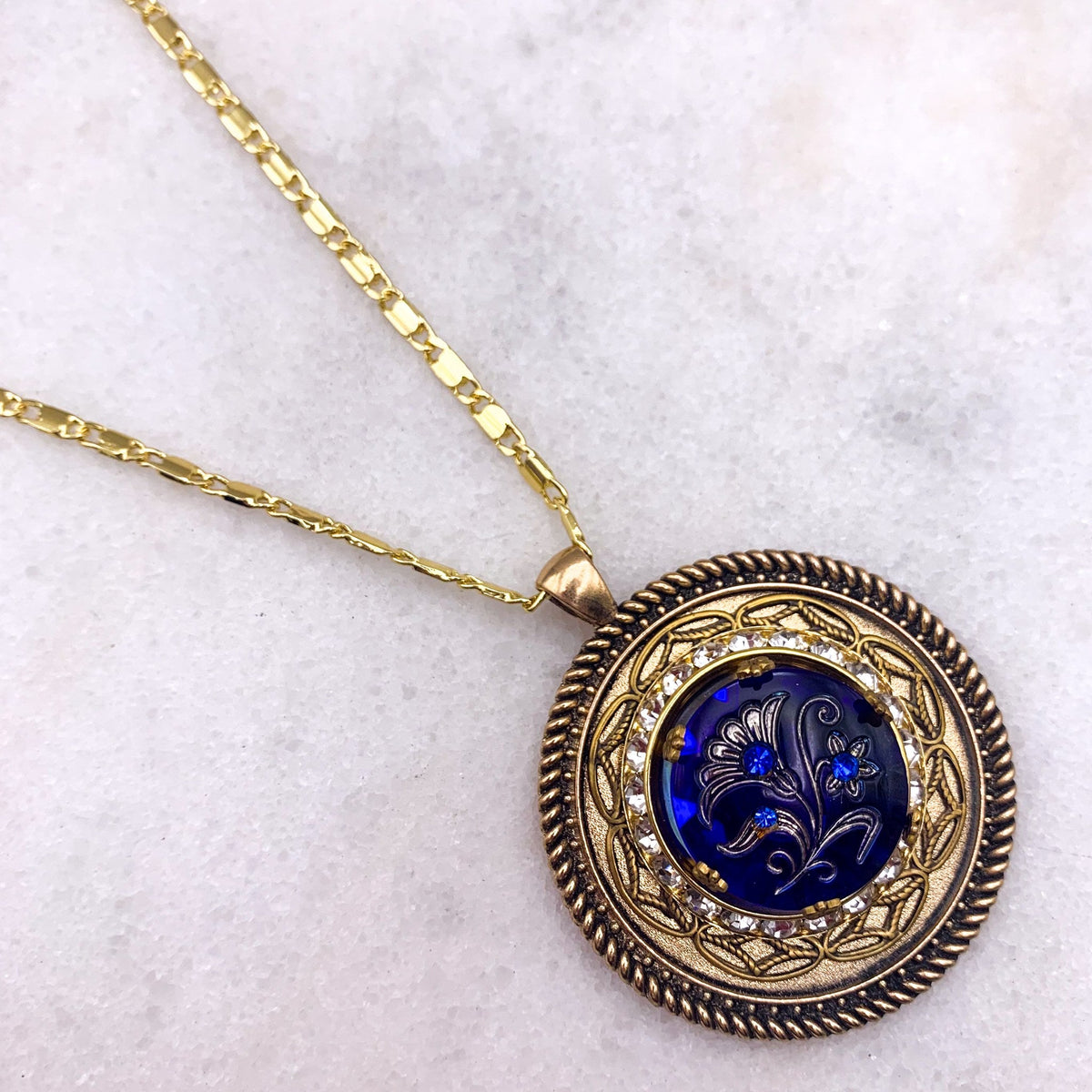 Ghost and Lola Subliminal Necklace pendant close up